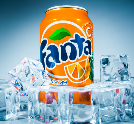 MOSCOW, RUSSIA-APRIL 4, 2014: Can of Coca Cola company soft drink Fanta Orange on ice. Fanta is a global brand of fruit-flavored carbonated soft drinks created by The Coca-Cola Company.のeditorial素材