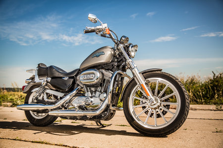 RUSSIA-JULY 7, 2013: Harley-Davidson Sportster 883 Low. Harley-Davidson sustains a large brand community which keeps active through clubs, events, and a museum. Filter applied in post-production.のeditorial素材