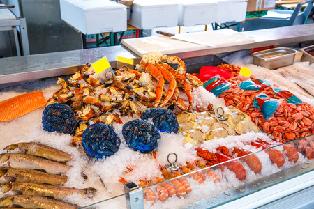 Various seafood on the shelves of the fish market in Norway, Bergenの写真素材