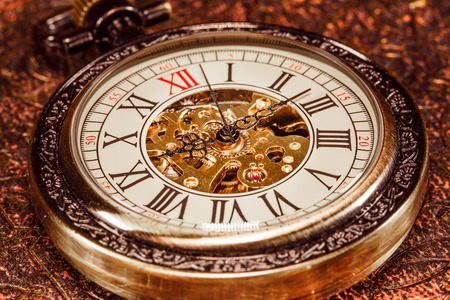 Antique clock dial close-up. Vintage pocket watch.