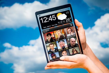 Tablet with a transparent display in human hands. Concept actual future innovative ideas and best technologies humanity.の写真素材