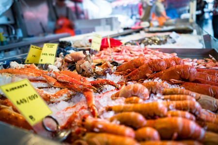 Various seafood on the shelves of the fish market in Norway, Bergen