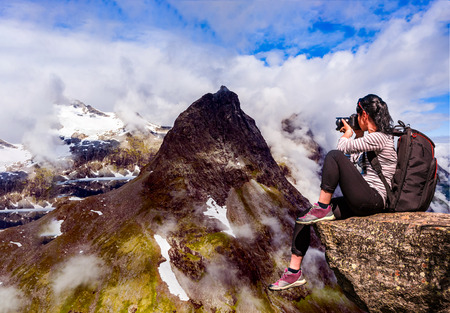 Geiranger fjord, Beautiful Nature Norway panorama. Nature photographer tourist with camera shoots.