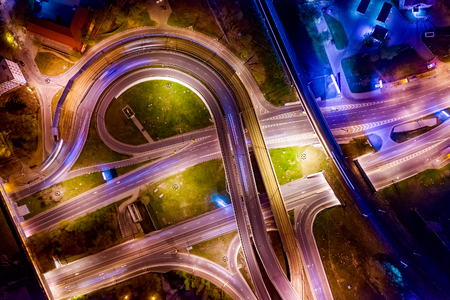 Night Aerial view of a freeway intersection traffic trails in night Moscow