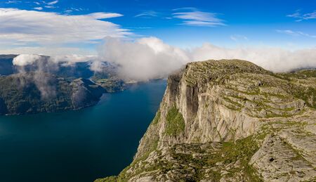 Preikestolen or Prekestolen, also known by the English translations of Preacher's Pulpit or Pulpit Rock, is a famous tourist attraction in Forsand, Ryfylke, Norwayの写真素材