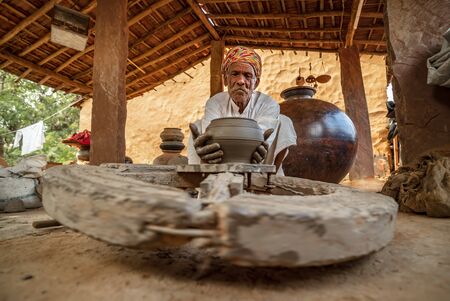 Potter at work makes ceramic dishes. India, Rajasthan.の写真素材