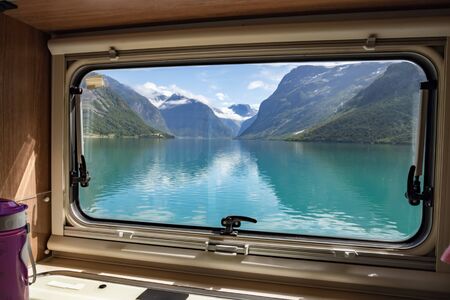 View from the window of the motorhome RV Caravan on the beautiful nature of Norway. lovatnet lake...
