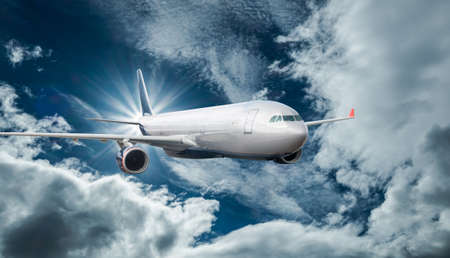 Passenger Airliner flying in the clouds
