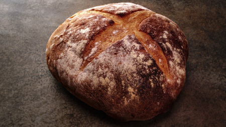Freshly baked natural bread is on the kitchen table.