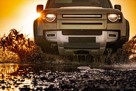 Off road tourist car rides off-road in the highlands. Expedition travel and vacation, adventures in remote areas.の写真素材