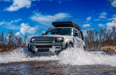 Rybachy, RUSSIA - May 30 2022: Off-roading New Land Rover Defender. The Land Rover Defender is a series of British off-road cars and pick-up trucks.のeditorial素材