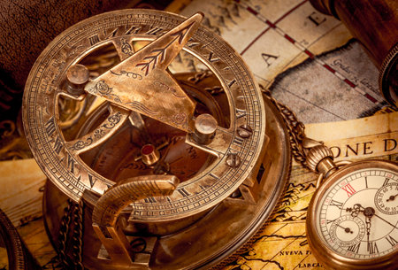 Vintage style travel and adventure. Vintage old compass and other vintage items on the table.の写真素材