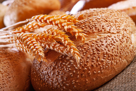 Fresh baked bread. Assorted bakery products loafs of bread and rolls...の写真素材