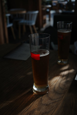 Glasses of light beer with at bar.の写真素材