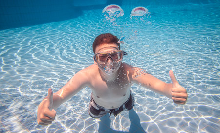 Teenager underwater in a swimming pool...の写真素材