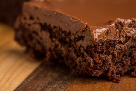 Chocolate Fudge Brownies on striped wooden cutting boardの写真素材