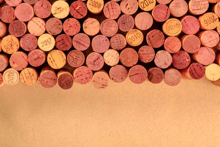 Wine corks background, a design template for a restaurant banner or tasting invitation, shot from...