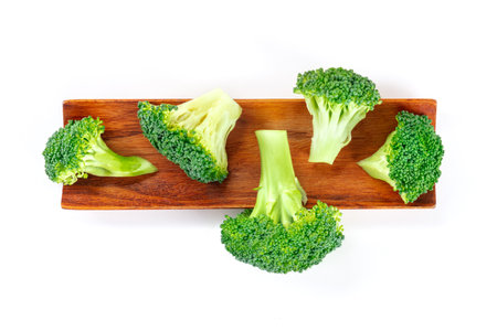 Broccoli florets, shot from above on a wooden board. Cooking organic vegetablesの写真素材