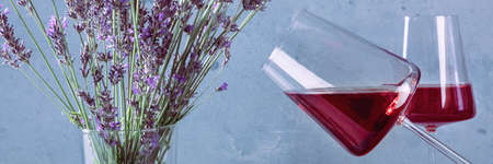 Rose wine panorama with lavender flowers. A panoramic banner for a French restaurant menuの写真素材