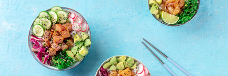 Poke bowl variety panorama with chopsticks. Healthy Hawaiian dish with salmon, tuna, and shrimps,...
