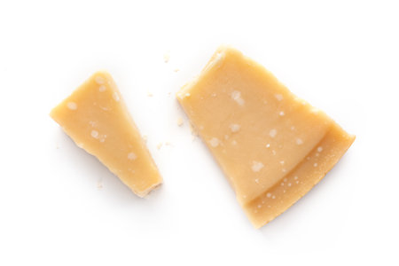 Cheese piece, cut, isolated on a white background, overhead flat lay shotの写真素材