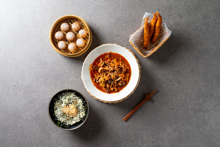 Dumplings, webfoot octopus, king shrimp, fried food, flying fish roe, rice balls, vegetables, side dishesの写真素材