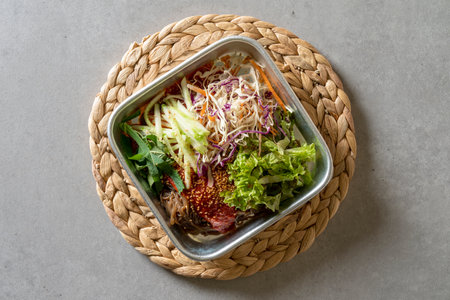 Jokbal, pork, steamed, spicy, tray, noodles, side dishes, salted shrimp, lettuce, garlicの写真素材