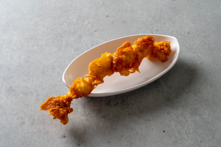 Large fried shrimp, big fried pepper, squid, sweet potato, bread, and fried food