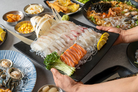 Raw cod soup, ecological soup, gomchi soup, seafood pancake, dongtaejeon, seafood sashimi, mulhoe, Korean food,Assorted Sliced Raw Fishの写真素材
