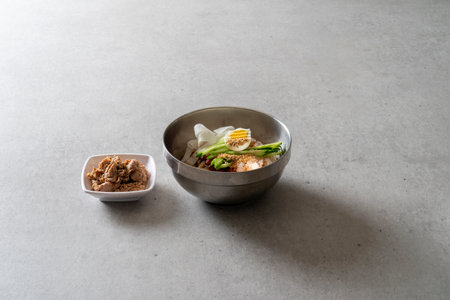 Cold noodles, spicy noodles, cold noodles, charcoal-grilled dumplings Korean food dishの写真素材