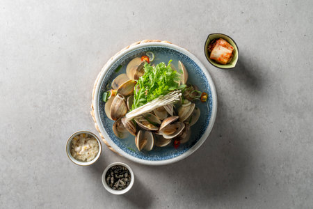 Steamed clams, sujiodengtang, fish cake soup, lily, clear soup, shrimp, chicken stew, braised spicy chicken, herbal medicine, seafood soup, salmon sashimi Korean food dishの写真素材