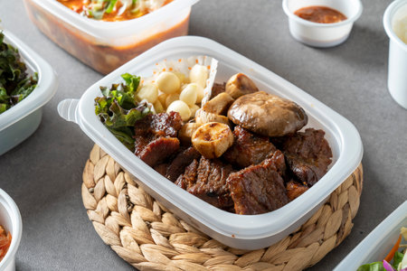 Korean food, ribs, gondre, bulgogi, cup rice, rice, vegetables, side dishes, lettuce, kimchi,...