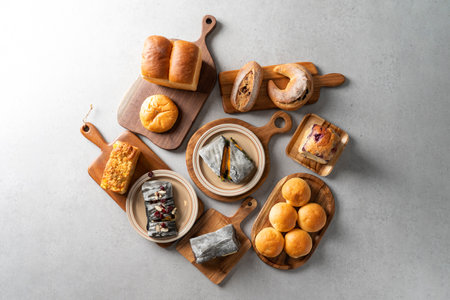 Bread, butter, pretzel, panini, castella, whipped cream, egg tart, campagne, fig, scones, earl grey, plain, smore cookies, bread, chestnuts, lemon, madeleine, sweet red bean bread, americano, coffeeの写真素材