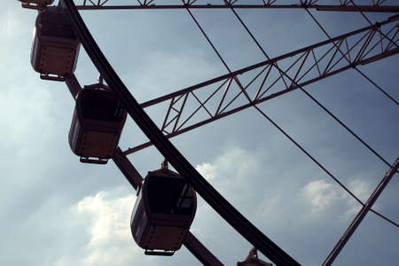 Part of Ferris wheel against blue skyの写真素材