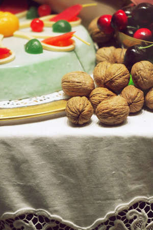 Table arrangement walnuts cherry cakeの写真素材