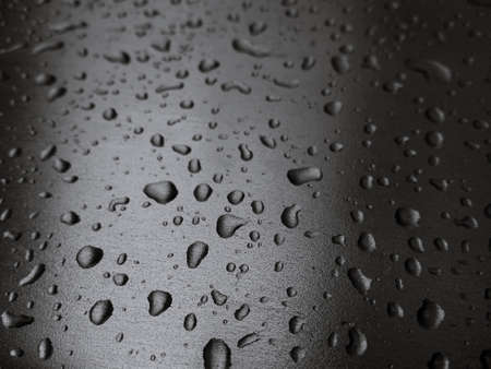 drop of water Close Up, Macro on silver metal surface SELECTIVE FOCUSの写真素材