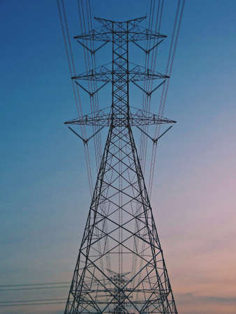 Electrical Transmission power line tower post pole against blue sky