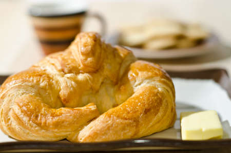 Croissant with cheese and cookies on a tableの写真素材