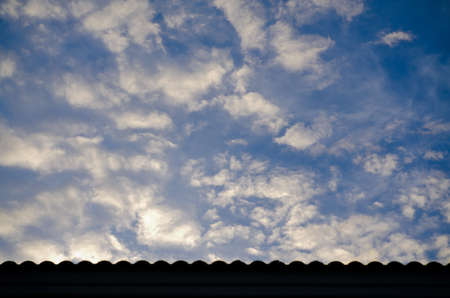Cloudy Sky with Roofの写真素材