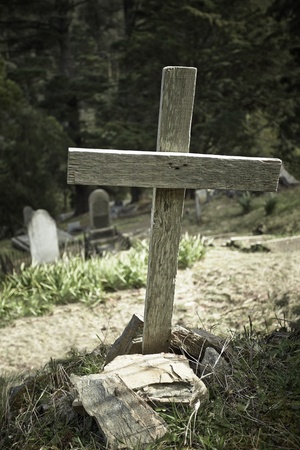 Solo wooden cross in old cemetaryの写真素材