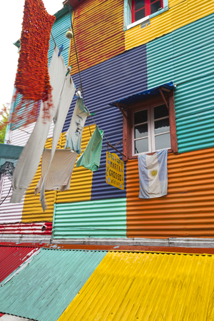 Clothes hanging in the colourful La Boca district of Argentinaのeditorial素材