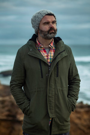 Male model on rugged coastlineの写真素材