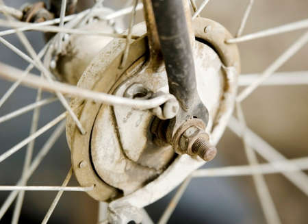 Rusty old bicycle wheel close upの写真素材