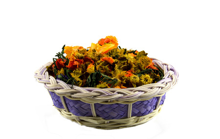 dried flowers, in wicker basket, isolated on whiteの写真素材