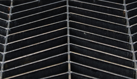 Close detail background of a steel grid pattern.の写真素材