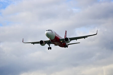 CHIANGMAI, THAILAND- AUGUST 25 2014 : HS-BBK Airbus A320-216 of Thai airasia. Landing to Chiangmai International airport , thailand.のeditorial素材