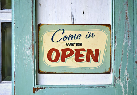 Vintage open sign on old wooden doorの写真素材