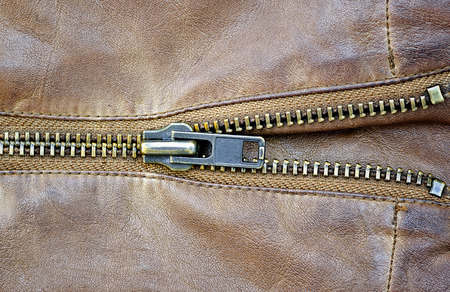 Brown leather texture and zipper.
