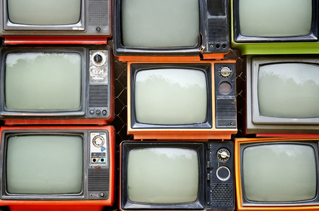 Stack of old and broken televisionsの写真素材