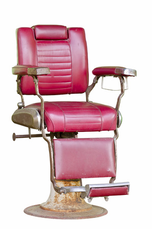 Old barber chair isolated on white background.の写真素材